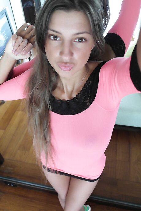 Russian beauty Malena Tara takes selfies as she strips and poses
