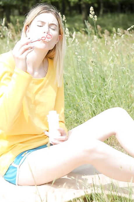 Sweet teen with a tasty muff Milena Devi fingers herself in nature